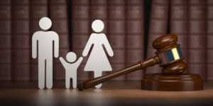 Divorce Litigation Attorneys Washington - Familty law. Gavel and shapes of men, women and child with books