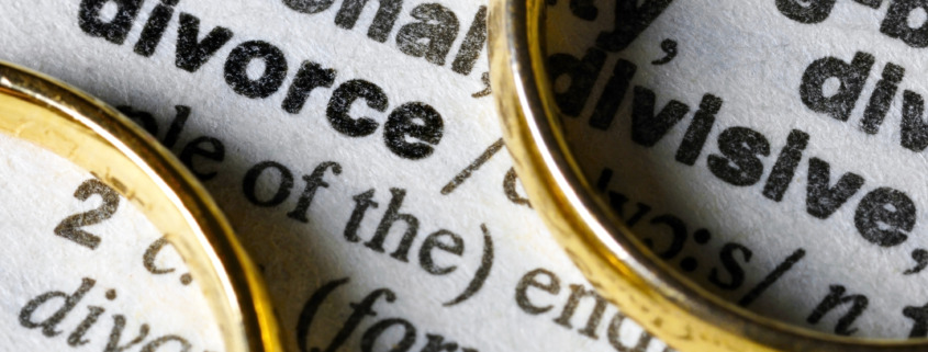 Why You Should Hire a Divorce Lawyer - Two separate wedding rings next to the word